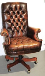 Executive Style Faux Leather Armchair On Wooden Swivel Base With Nail Head Trim