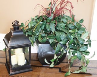 Decorative Lantern With A Relatively Finish Includes A Decorative Faux Plant Arrangement