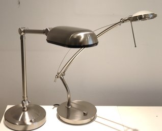 Two Matte Silver Colored Adjustable Desk Lamps.