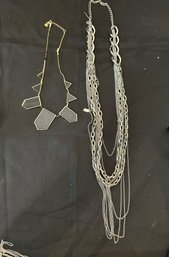 Two Costume Necklaces, One In Gold Tone, One Silver Tone