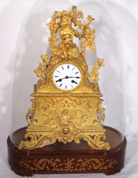 19th Century French Dore Bronze Clock On Inlaid Wood Base With Glass Dome.