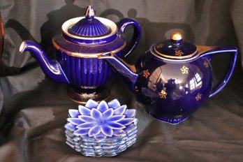 Two Hall USA Cobalt Blue & Gold Teapots And 6 Small Flower Shaped Plates.