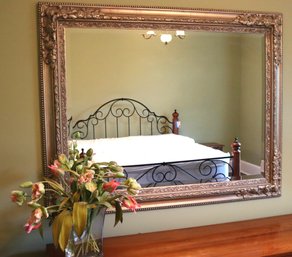 Large Ornate Wood Wall Mirror In A Silver Finish Includes A Faux Floral Arrangement