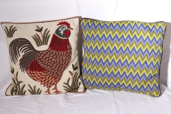 Two Vintage Pillows With Crewel Rooster Design And Blue Zig Zag Pattern.