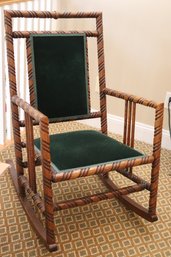 Unique Victorian Era Rocking Chair With Diagonally, Carved Wooden Frame And Velvet Seat And Back.