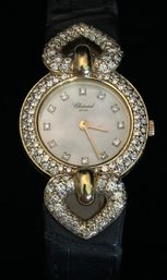 18K YG CHOPARD LADIES QUARTZ WATCH WITH. MOP DIAL, DIAMOND BEZEL, LUGS AND HOUR MARKERS SIZE 5.75 - 7