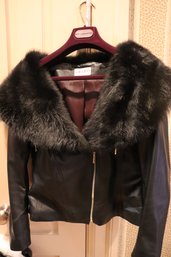A Ladies, Short Black Leather Jacket With Wide Fur Collar