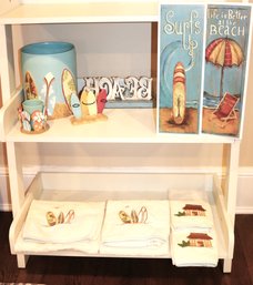 Collection Of Beach Themed Bathroom Accessories Includes Wastebasket, Towels, Toothbrush Holder