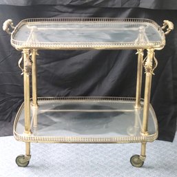 Impressive Baroque Style Brass Bar Cart With Glass Shelf On Casters.