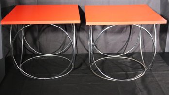 Pair Of Modernist Side/ End Tables With Circular Chrome Bases, And Reddish Orange Tops.