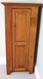 A Country Style Pine Cabinet With A Tall Door, And Shelves