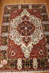 Handmade Oriental Wool Area Rug, With White Center Medallion, And Red Background.