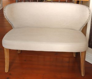 Love Seat With Gently Curved Back, Nail Head Trim And Tufting.