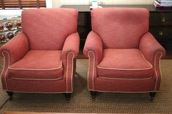 Pair Of Edward Ferrell Club Chairs With Rolled Backs And Wooden Feet With Brass Casters