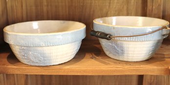 Two Salt Glazed Ceramic Bowls With A Light Blue Finish.