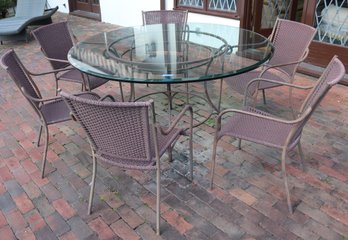 Patio Set Includes A Round Wrought Iron And Glass Table With A Beveled Edge And 6 Chairs With A Rustic Finish