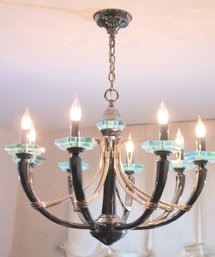Eight Light Modern Chandelier In The Style Of Fortana Art With Brass And Green Glass Accents.