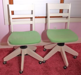 Two Pottery Barn Teen White Wood Swiveling Desk Chairs With Green Seat Pillows.