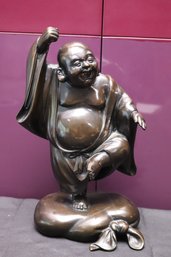 A Standing Bronze Buddha Statue With Happy Expression, And Upraised Hand.