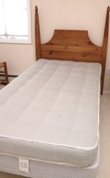 A Shaker Style Poster Twin Headboard With Shiffman Mattress And Box Spring.