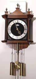 European Wall Clock With Elegant Wooden Case, Black Painted Columns, Angel Adornments, Pendulum, And Brass Wei