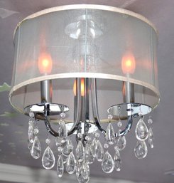Stylish Contemporary Chandelier With A Polished Chrome Finish & Hanging Crystals
