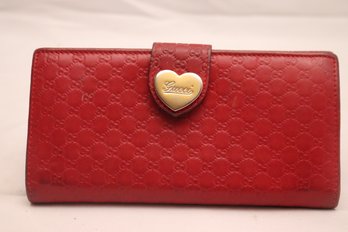 A Red Gucci Preowned Ladies Wallet With Heart Clasp
