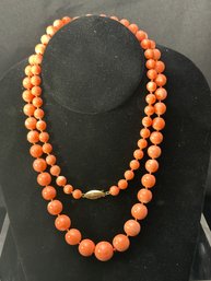 32 Inch Graduated Size Polished Pink Coral Necklace With 14k YG Clasp