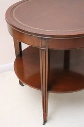 1940s Era Mahogany, Leather Top Table With Shelf And Casters.