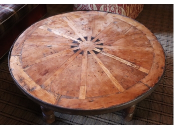 Rustic Reclaimed Round Wood Coffee Table With Metal Banding, Looks To Be Made Out An Old Wagon Wheel