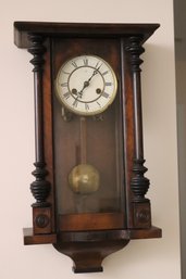 Carved Walnut Clock With Pendulum And Key.