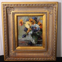 Impressionist Style Painting Of Blue And Orange Summer Flowers Enhanced By A Wide Gold Frame.