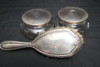 Two Etched Glass Cosmetic Jars With Sterling Silver Tops And Sterling Top Hairbrush.