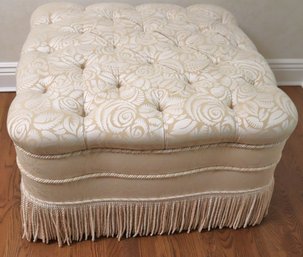 Gorgeous Cream Toned Tufted Ottoman With Tassels And Piping Along The Edges