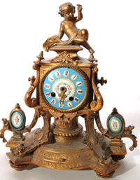 French Clock Stamped P.H. Mourey With Blue Enamel Face & Side Panels And Cherub Ornament On Top