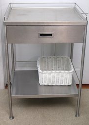 Metal Cart With 1 Drawer, A Shelf, And White Wicker Basket.