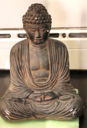 Vintage Buddha Meditating Cement Statue Having A Dark Grey Overall Finish.