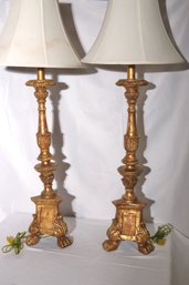 Tall Italian Candlestick Lamps With Gold Leaf Over A Painted Finish.