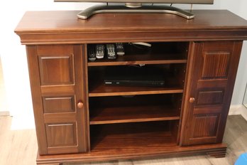 Entertainment Unit With Fold Out Doors And Plenty Of Storage.