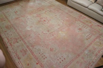 Antique Turkish Oushak Hand Woven Wool Rug With Pink Floral Tones Measures Approximately 13 Feet X 9.5 Feet.