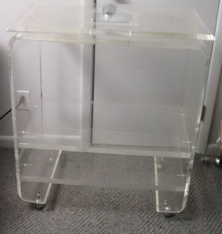 Retro Look Lucite TV Stand With Swivel Top And Casters.