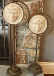 Two Interesting Metal And Terracotta Swivel Floor Ornaments With Classical Faces And Mirror Backs.