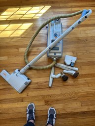 An Electrolux Legacy Canister Vacuum Cleaner With Attachments