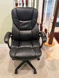 A Tall Black Vinyl Office Chair With Swivel By Simon Warehouse Furniture