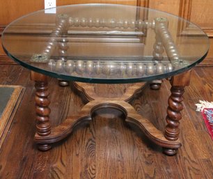 A Retro Style Round Coffee Cocktail Table With Barley Twists And Thick Glass Top.