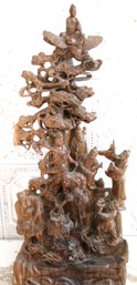 Symbolic Chinese Carved Wood Sculpture With Stylized Trees, Clouds And Buddha Figure Atop Bird