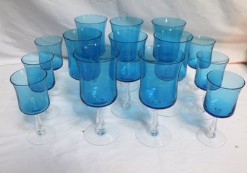 Set Of Blue Colored Stemmed Wine, Glasses, And Cordials.