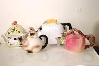 Lot Of 4 Vintage Ceramic Teapots With Cat, Apple, Toaster, And Strawberry Vines Designs.