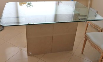 Rectangular Beveled Glass Dining Table On Porcelain Tile Base.