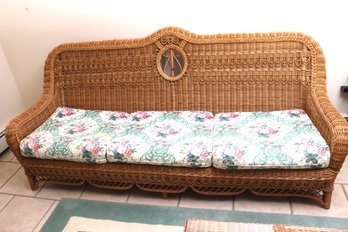 A Wicker Sofa By Henry Link, With Hand Worked Details And Floral Seat Cushions